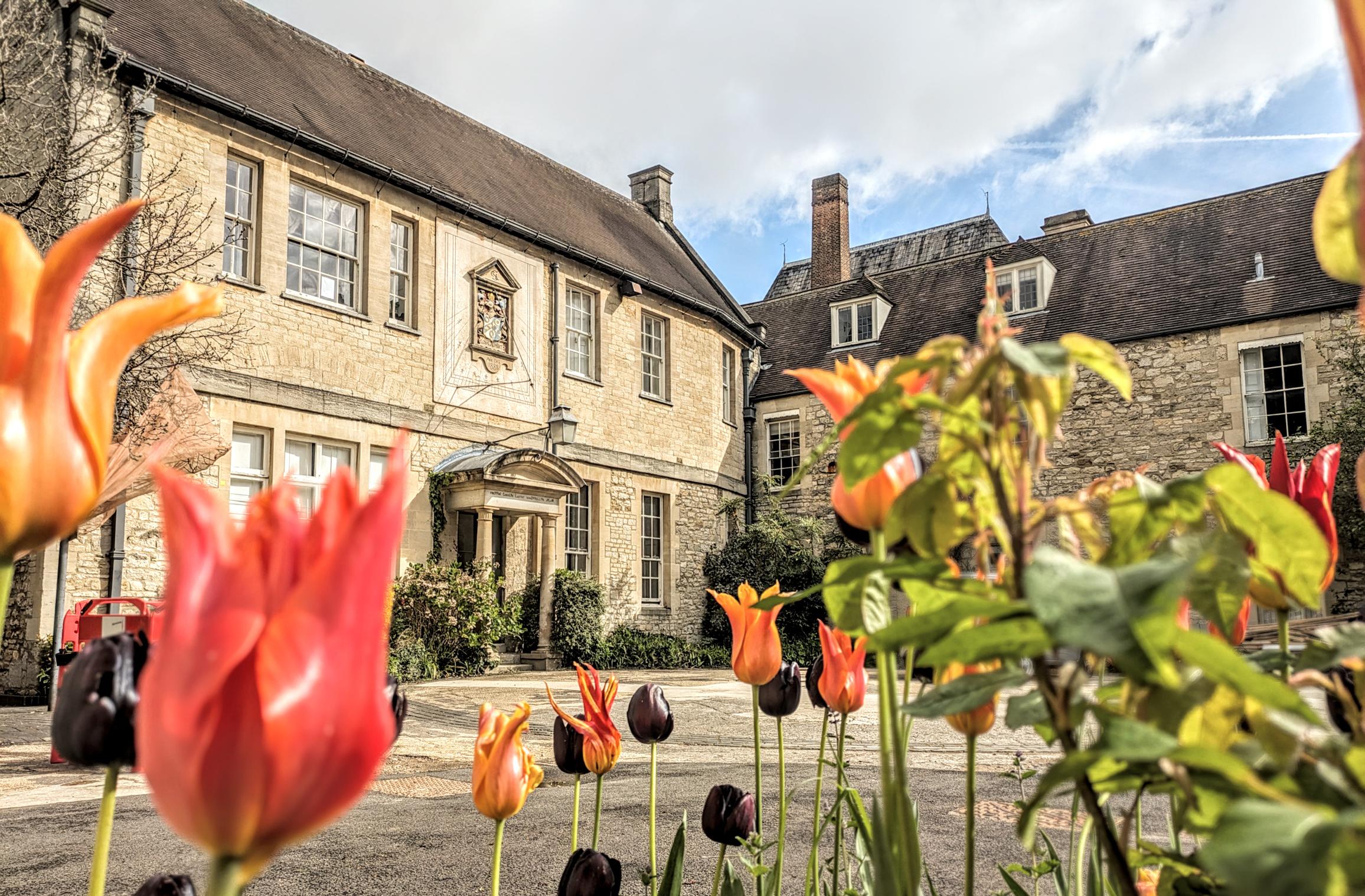 Frewin Hall with flowers in foreground