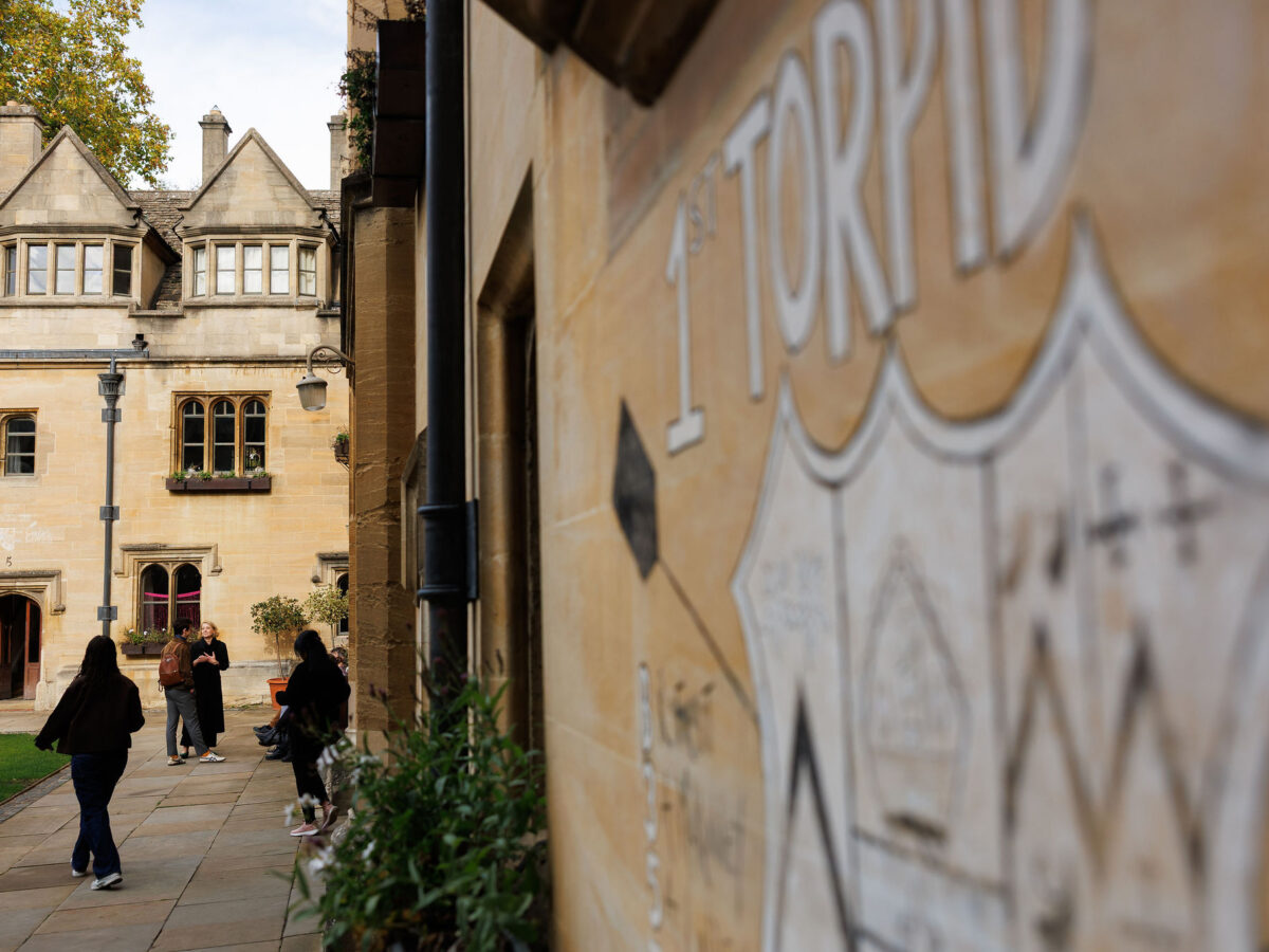 Stone wall with decorative lettering partially visible