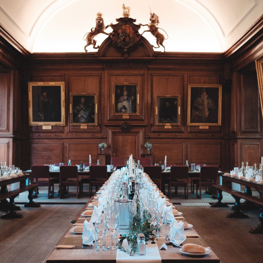 Formal dinner set up in a college dining hall