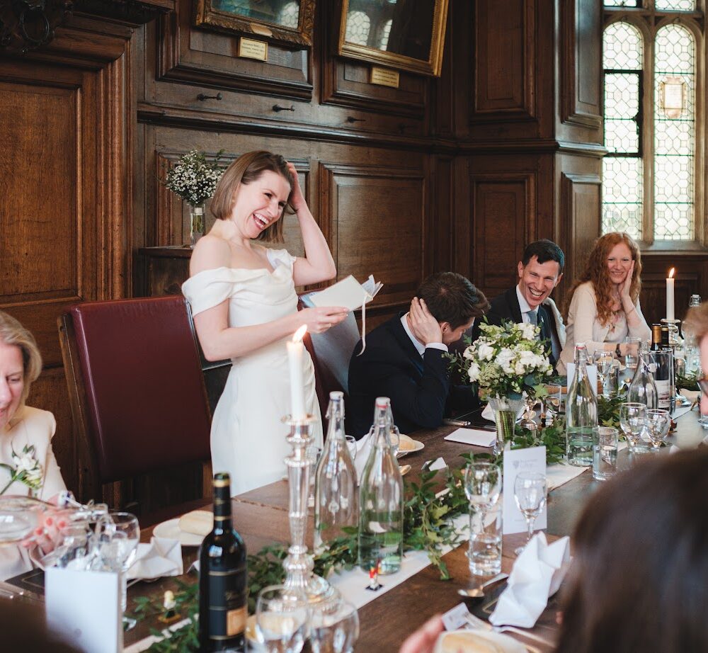 Top table at a wedding with the Bride giving a speech