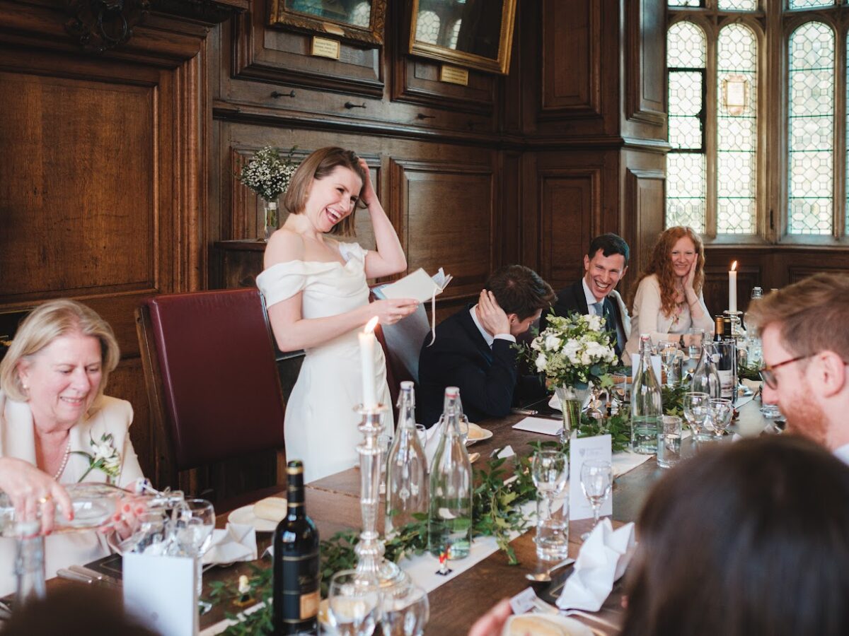 Top table at a wedding with the Bride giving a speech