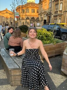 Image of Erin Bridgewater sat on a wall