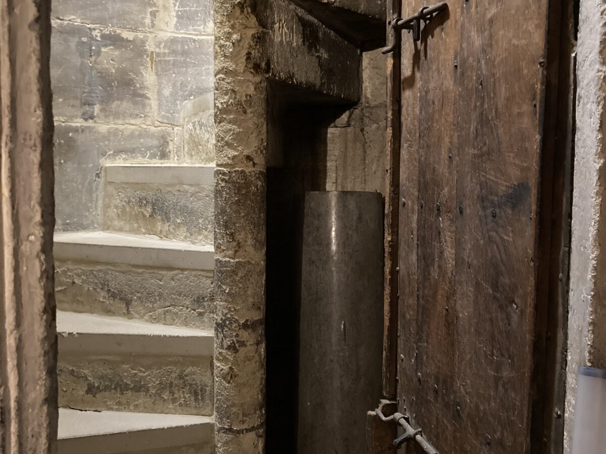 Narrow stone passageway or doorway inside a historic building