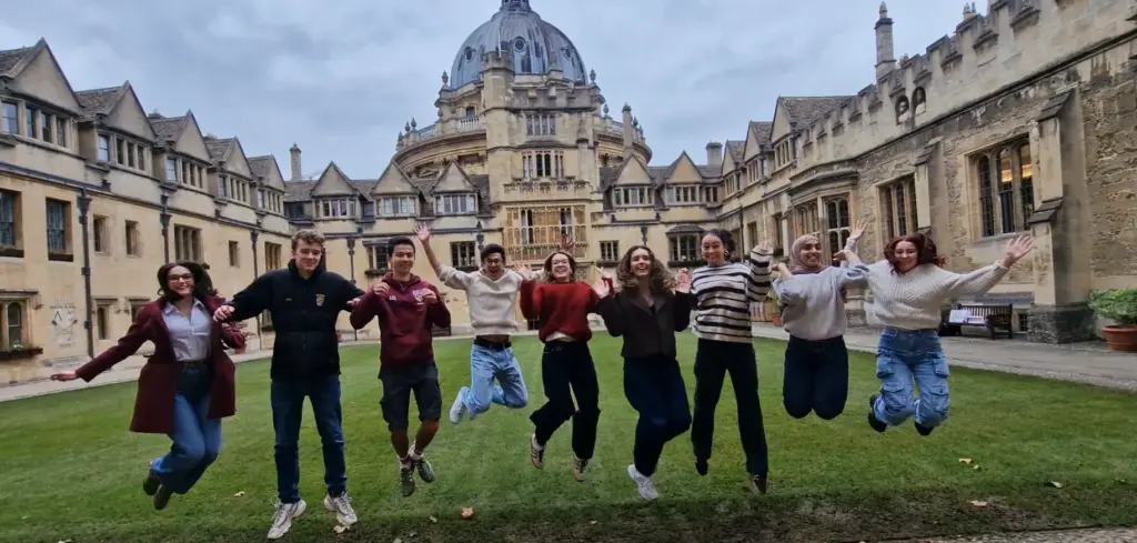 A group of Brasenose students jumping for joy to celebrate Giving Day!