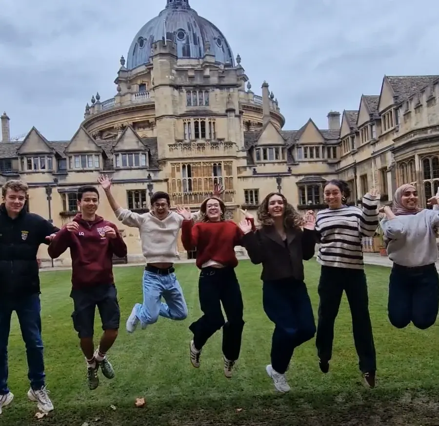 A group of Brasenose students jumping for joy to celebrate Giving Day