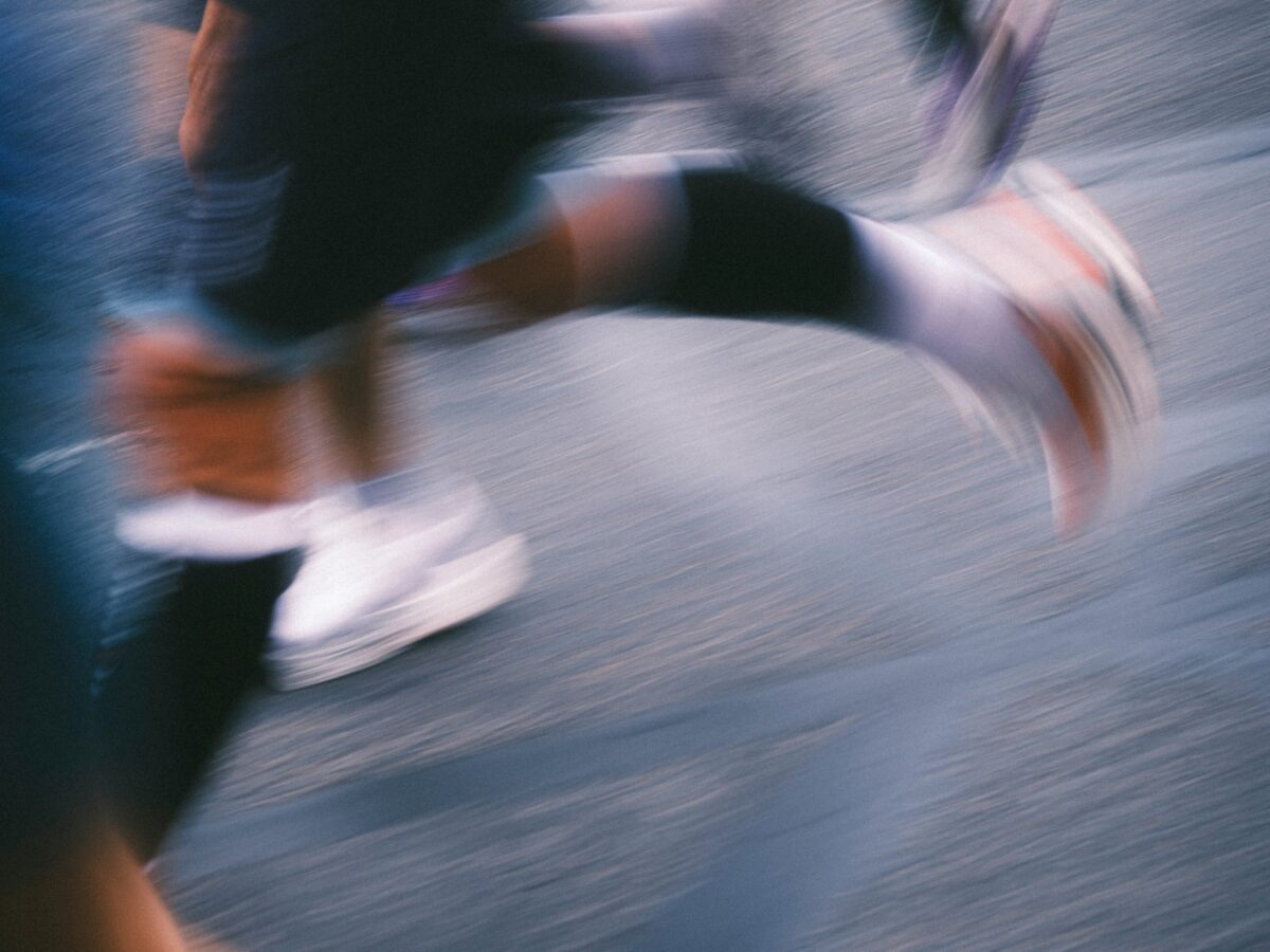 Blurred close-up of people moving past one another