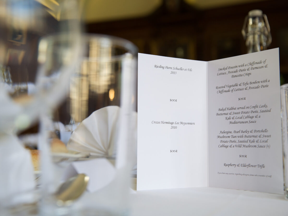 Printed menu or programme displayed on a dining table