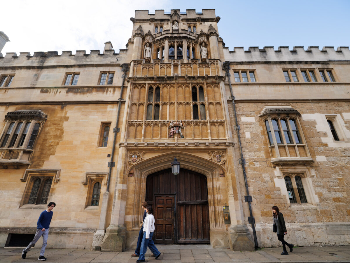 Entrance to Brasenose College from Radcliffe Square with people walking nearby