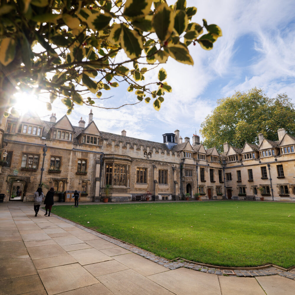 Wide view of the college quad with buildings and lawn