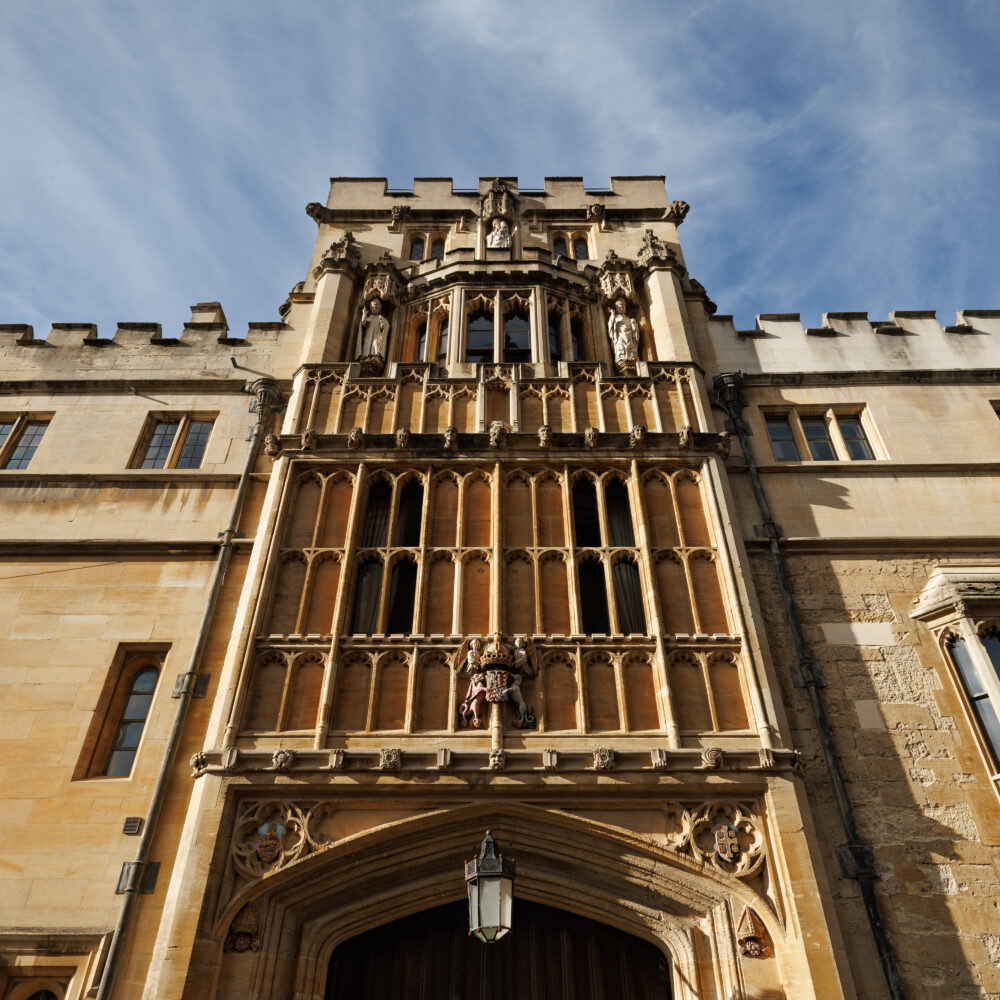 Tall stone entrance of a Brasenose College viewed from below