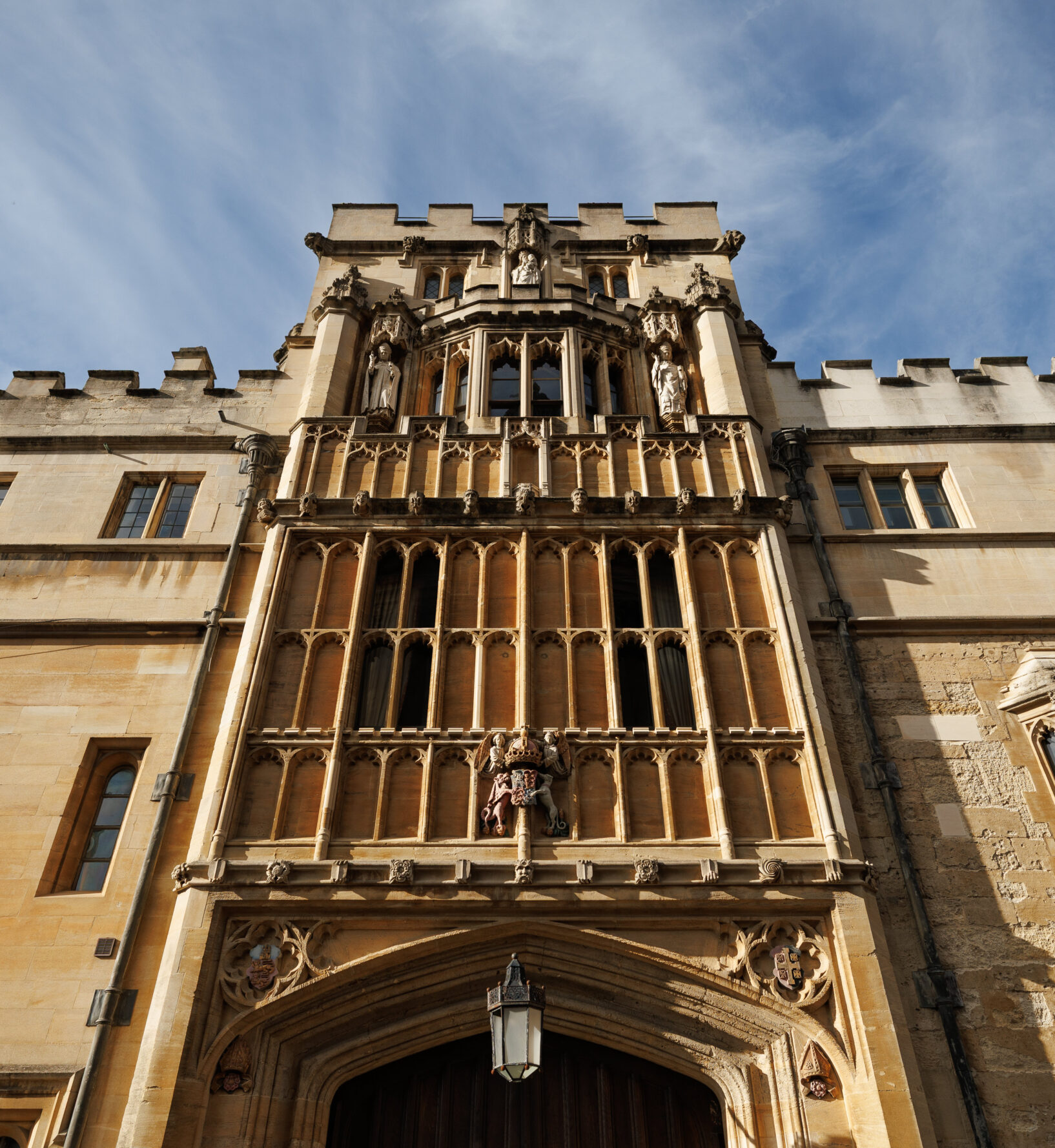 Tall stone entrance of a Brasenose College viewed from below