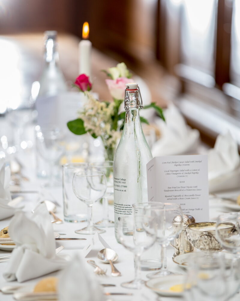 Table set for a formal meal with glassware and flowers