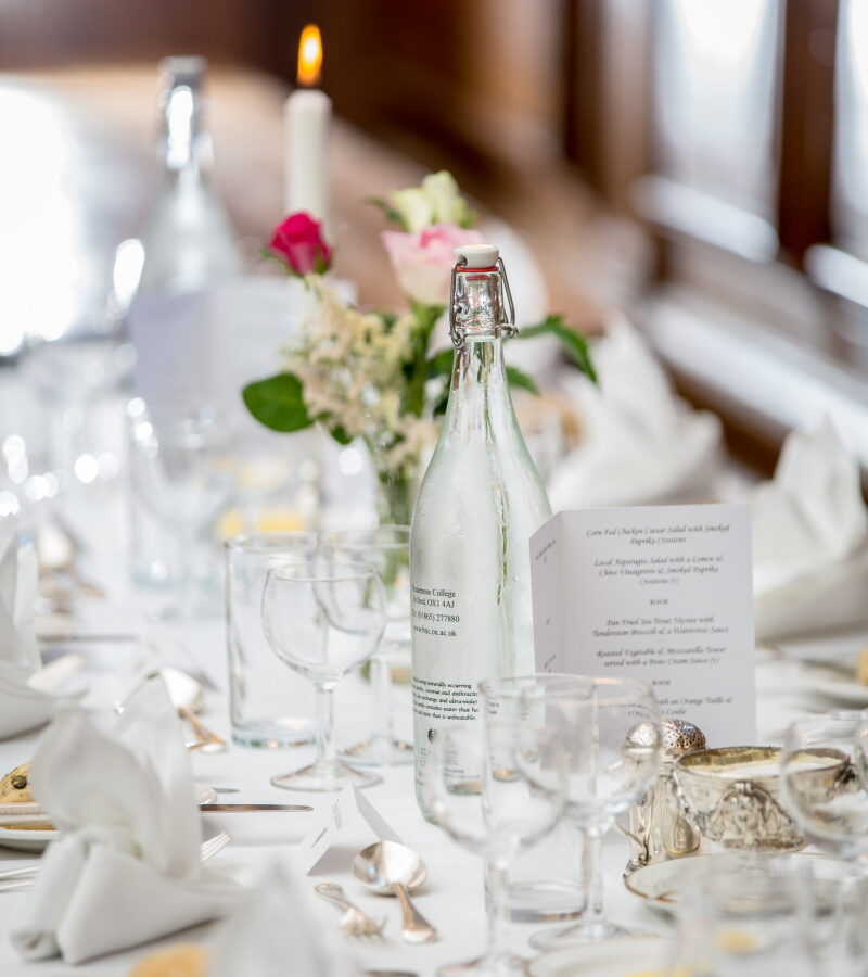 Table set for a formal meal with glassware and flowers