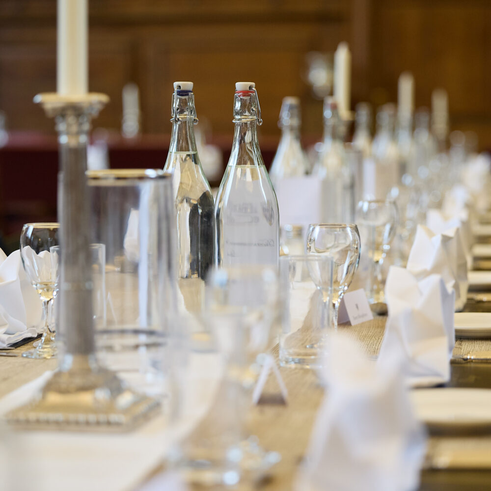 Glassware arranged neatly on a dining table in hall