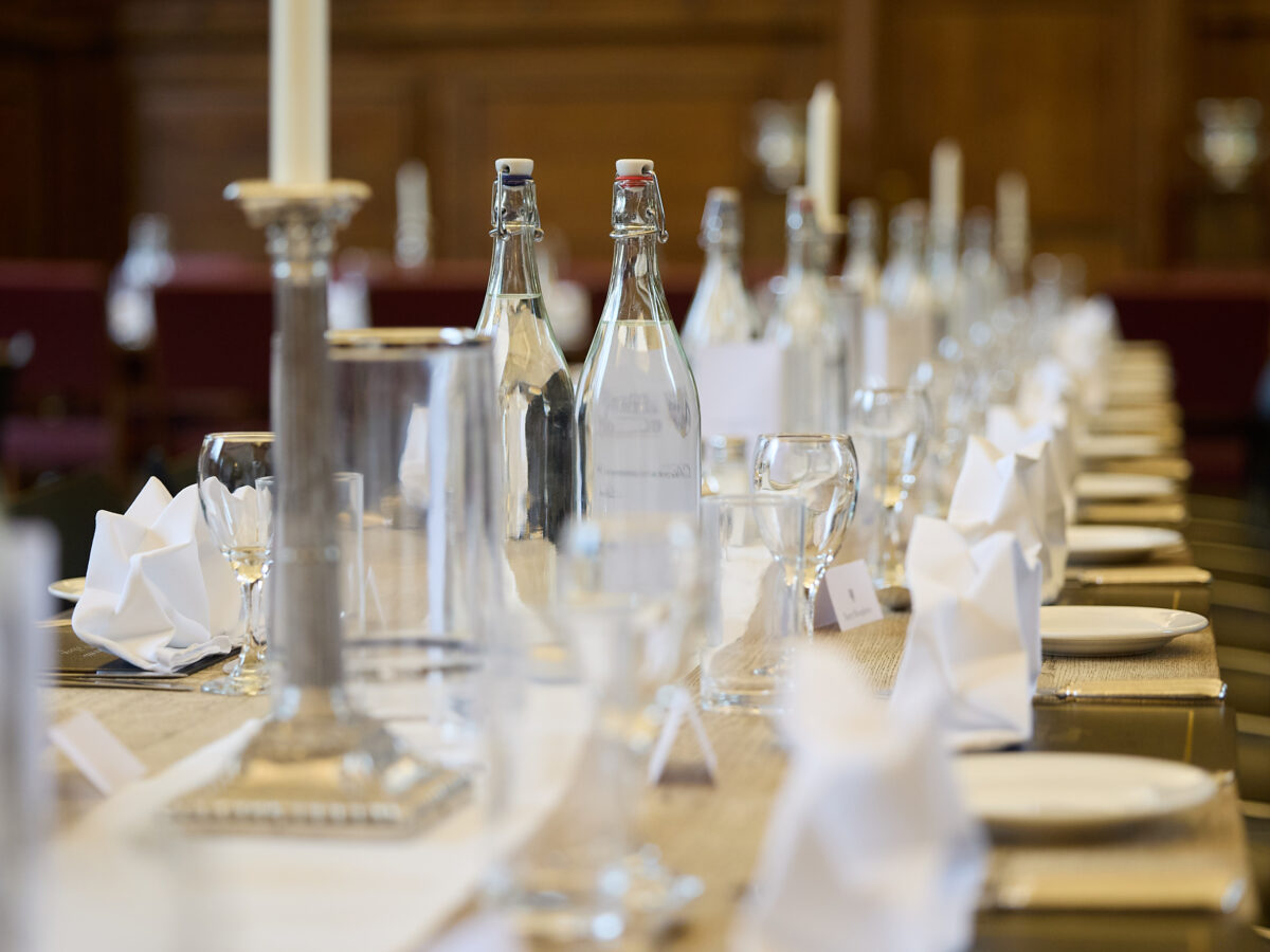 Glassware arranged neatly on a dining table in hall