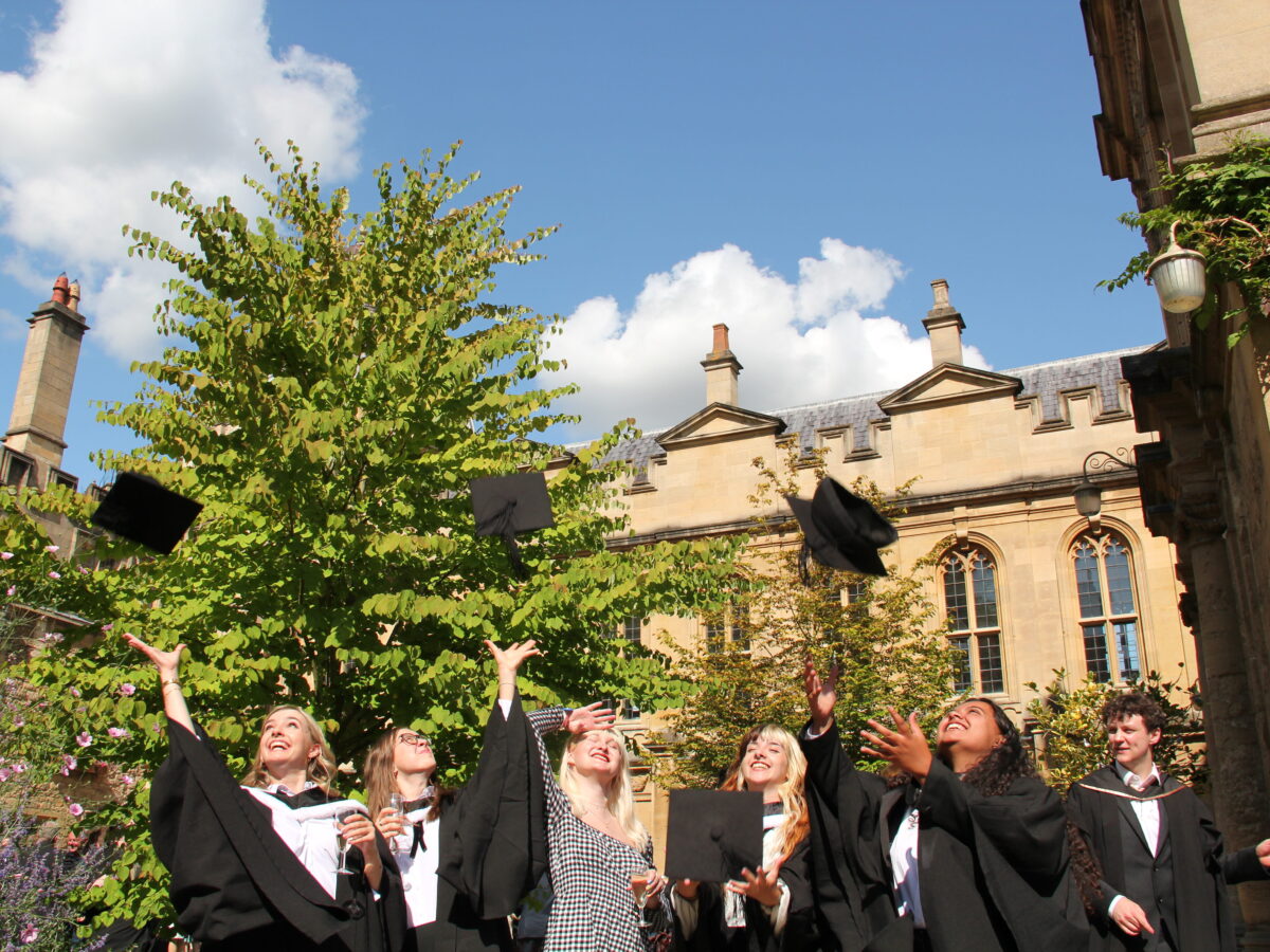 Students throwing their graduation caps in the air