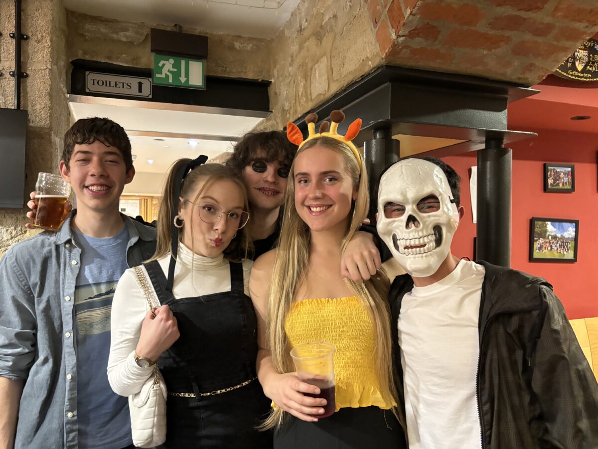 A group of students in fancy dress at the college bar