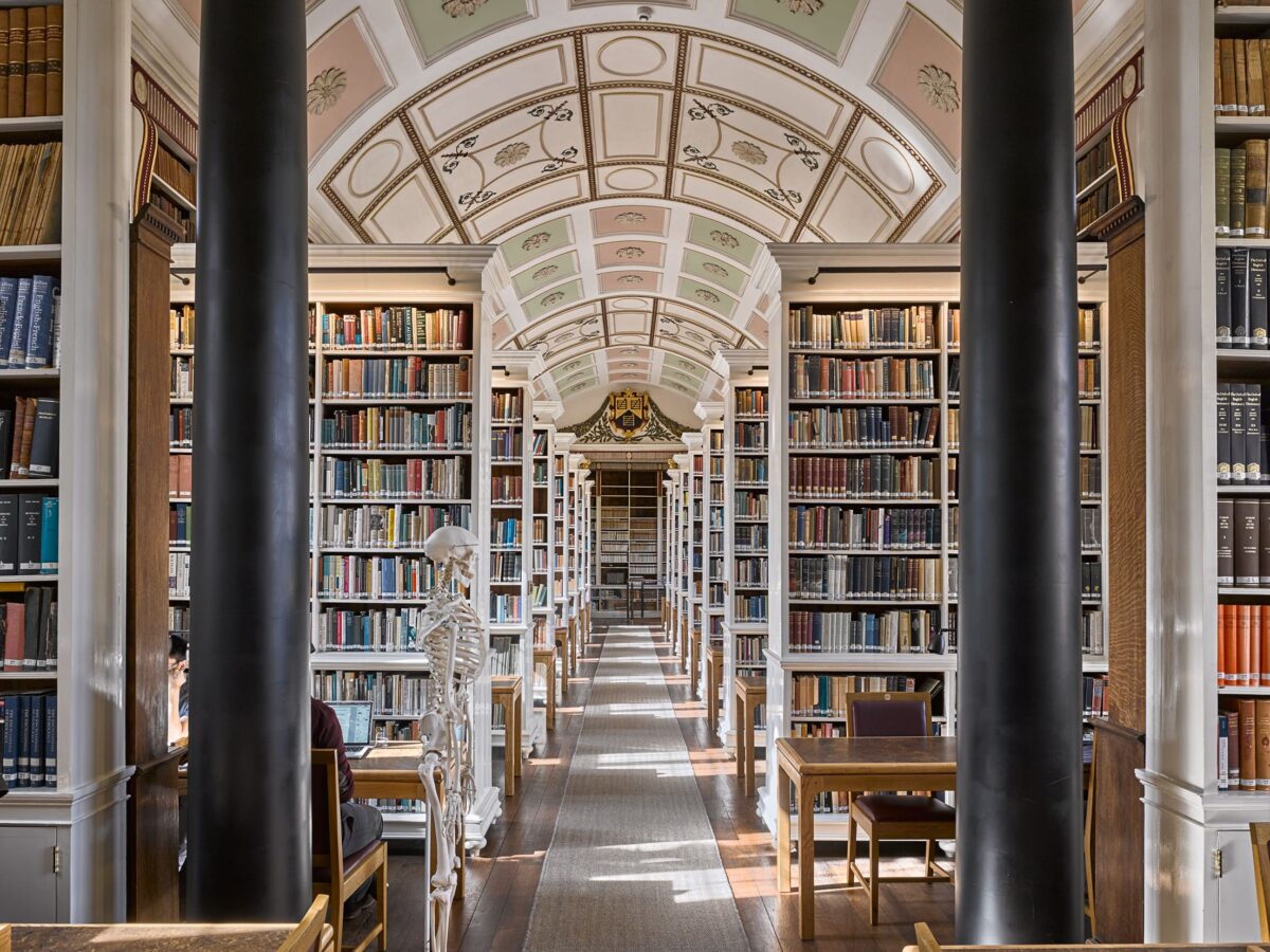 Interior view of the Main Library at Brasenose, with arched ceiling and shelving