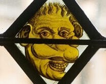 Brazen nose in the stained glass in Hall
