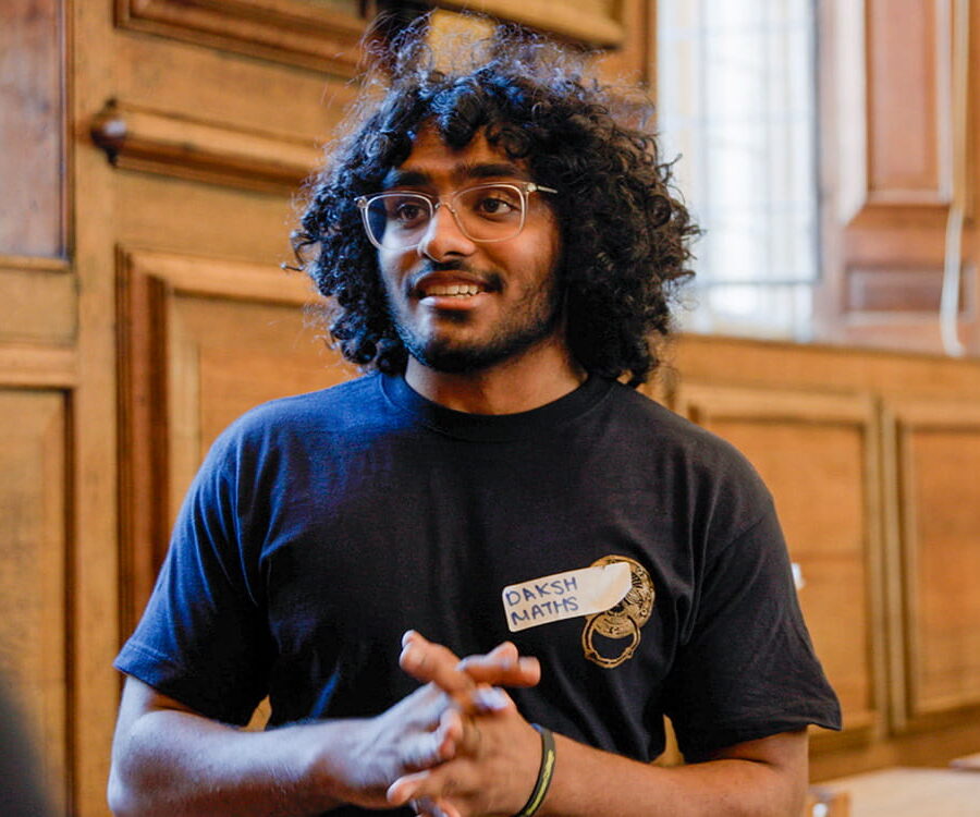 Student volunteer addressing a group in a college room