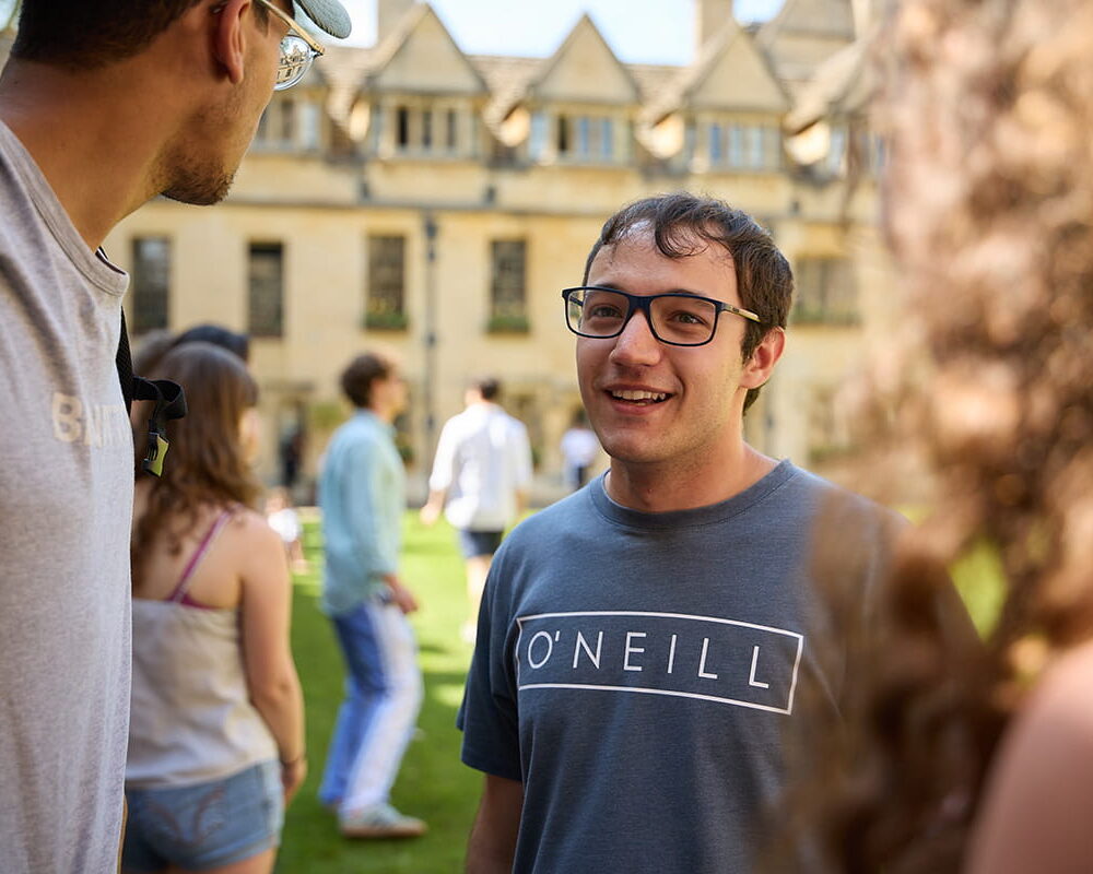 Postgraduate students chatting together in the quad