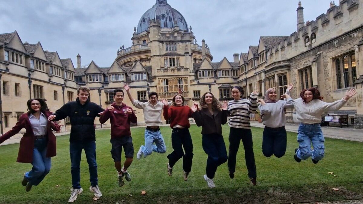 Students in Old Quad jumping