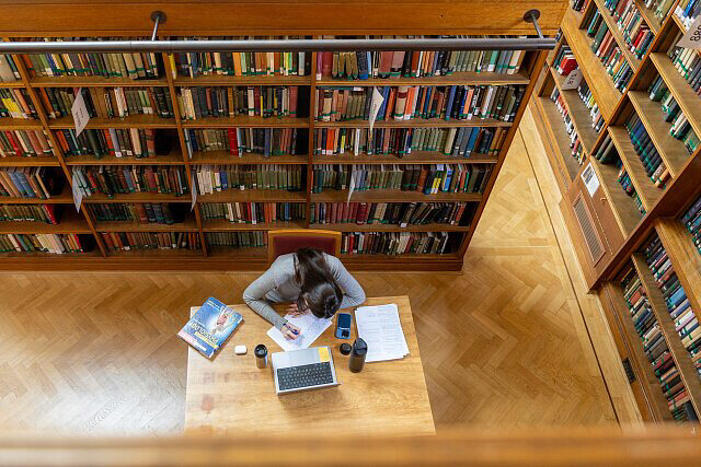 student studying in library