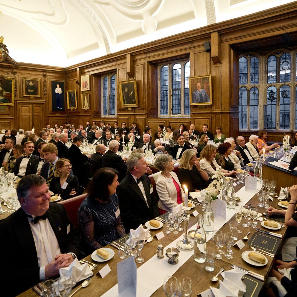 Alumni in hall in black tie