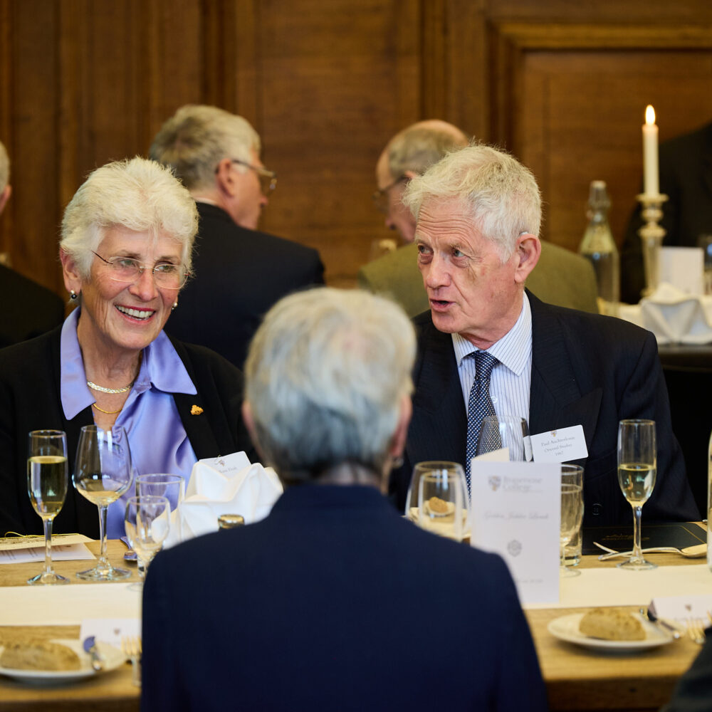 Group of three alumni talking whilst attending the Diamond Jubilee