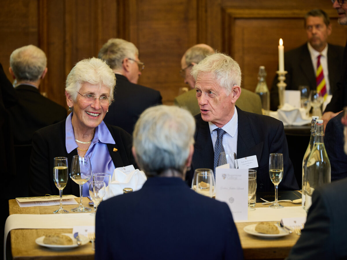 Group of three alumni talking whilst attending the Diamond Jubilee