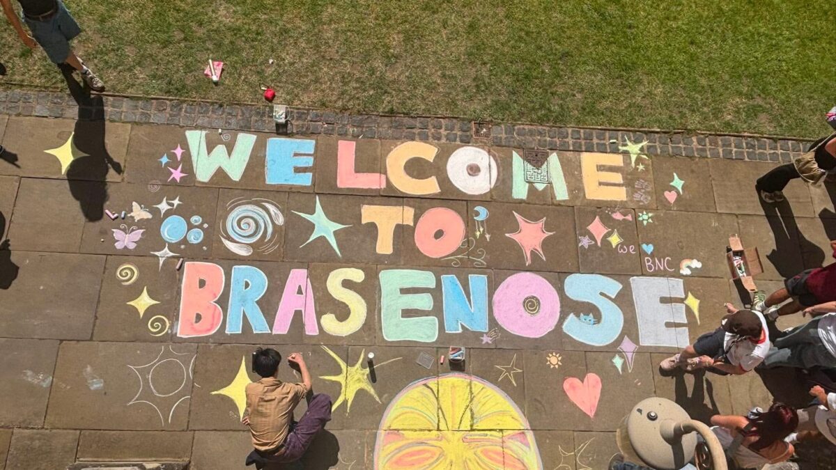 Welcome to Brasenose chalked on to flagstones in bright colours