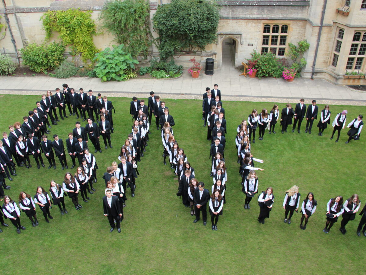 Students in exam uniform in shape of BNC letters